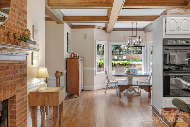 5750 Hemby Rd, Matthews, NC 28104 - dining space featuring ornamental molding, beamed ceiling, coffered ceiling, light wood-style flooring, and a notable chandelier
