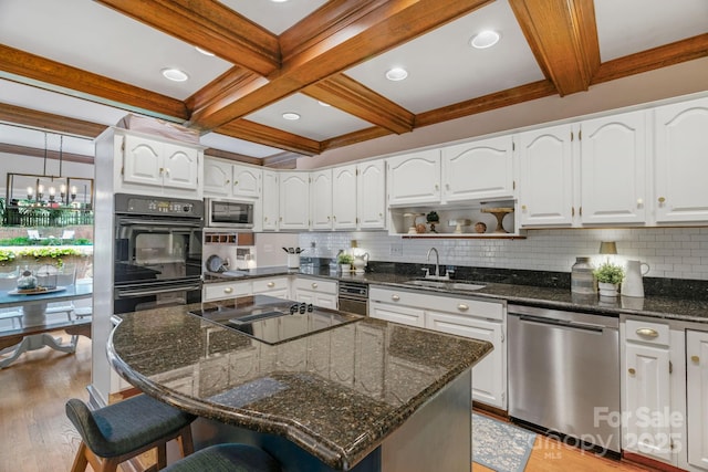 5750 Hemby Rd, Matthews, NC 28104 - kitchen featuring a sink, coffered ceiling, black appliances, and beam ceiling