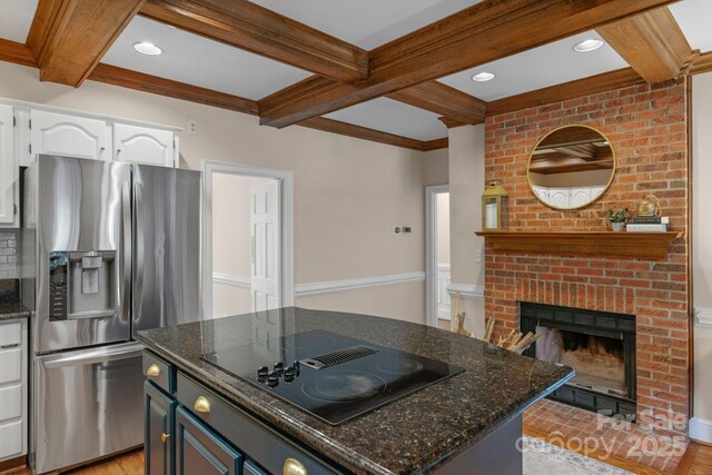 5750 Hemby Rd, Matthews, NC 28104 - kitchen with white cabinets, black electric stovetop, stainless steel fridge with ice dispenser, dark stone countertops, and beamed ceiling