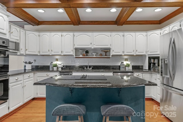 5750 Hemby Rd, Matthews, NC 28104 - kitchen featuring beam ceiling, a breakfast bar, stainless steel fridge with ice dispenser, a sink, and coffered ceiling