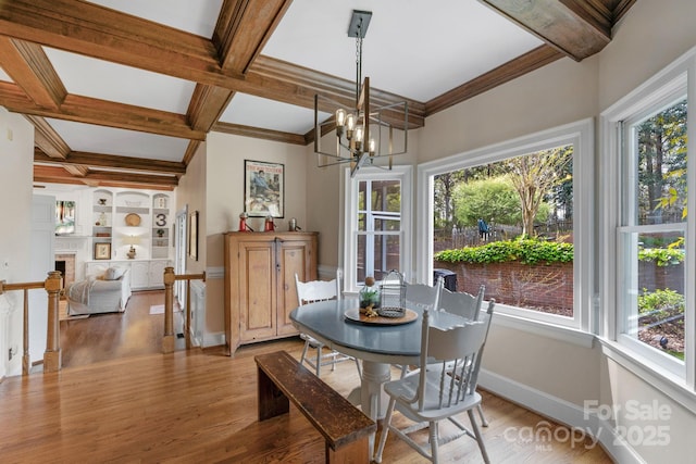 5750 Hemby Rd, Matthews, NC 28104 - dining room with beamed ceiling, baseboards, and wood finished floors