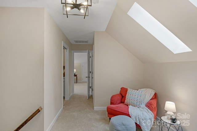 5750 Hemby Rd, Matthews, NC 28104 - living area featuring visible vents, baseboards, light colored carpet, a chandelier, and a skylight