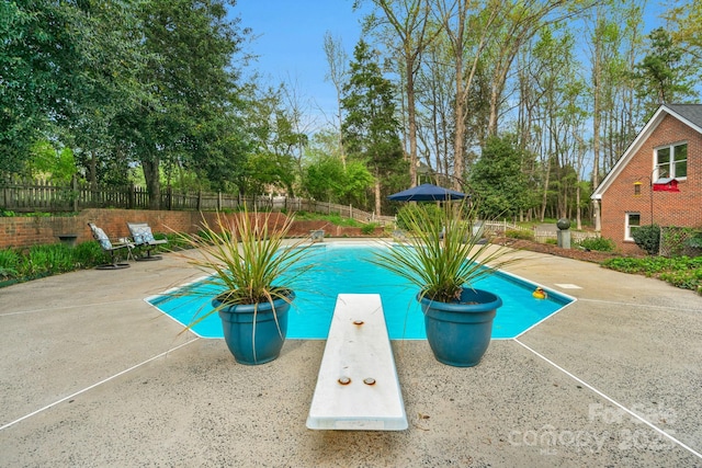 5750 Hemby Rd, Matthews, NC 28104 - view of swimming pool with a fenced in pool, a diving board, fence, and a patio