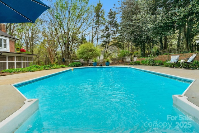 5750 Hemby Rd, Matthews, NC 28104 - view of pool with a fenced in pool, a sunroom, and a fenced backyard