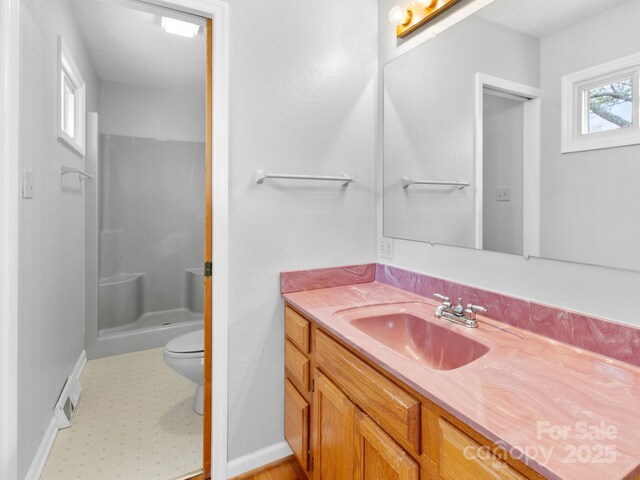 full bath with baseboards, toilet, a shower, vanity, and tile patterned floors