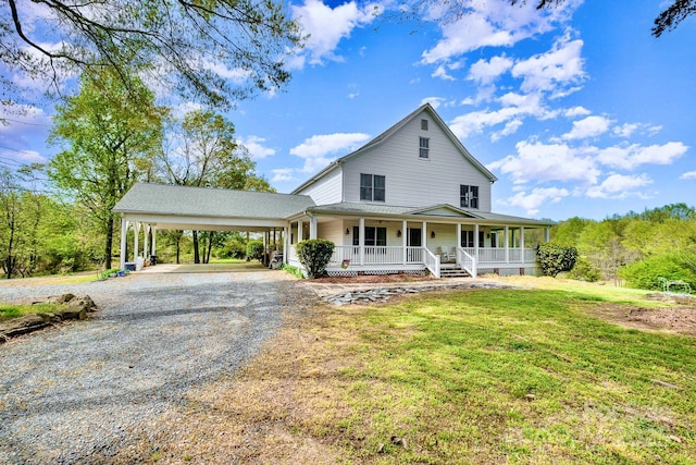 1151 Trull Hinson Rd, Wingate, NC 28174 - country-style home with a porch, driveway, a front lawn, and a carport