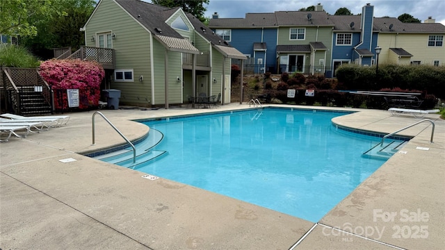 9036 Four Mile Creek Rd, Charlotte, NC 28277 - pool featuring fence, a patio area, stairs, and a residential view