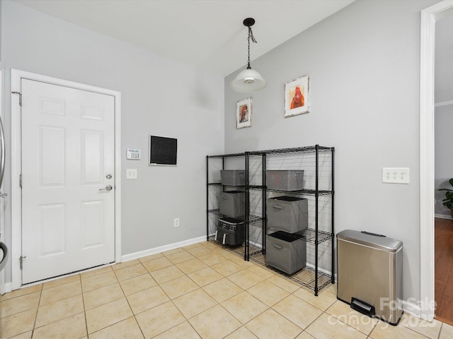 tiled foyer with baseboards