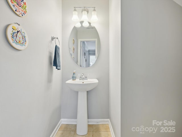 bathroom featuring tile patterned flooring and baseboards