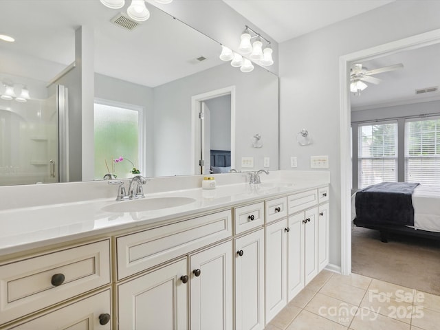 full bathroom featuring tile patterned floors, visible vents, and a sink