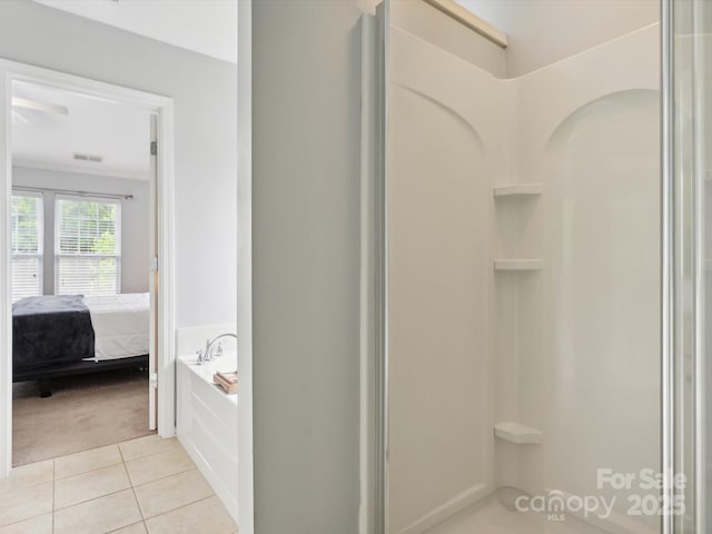 ensuite bathroom featuring a shower stall, visible vents, ensuite bathroom, tile patterned floors, and a garden tub