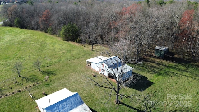 aerial view featuring a rural view and a view of trees