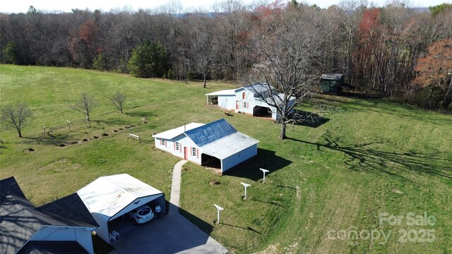 birds eye view of property with a rural view and a forest view
