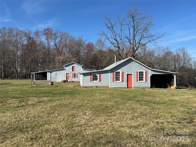 single story home featuring a front yard, a carport, and crawl space