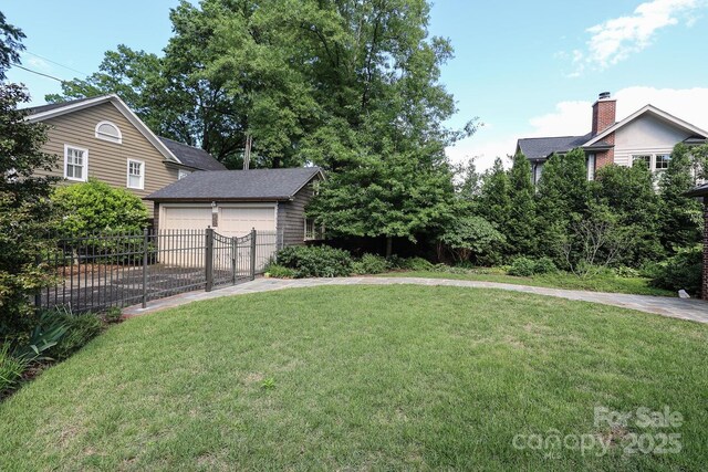 801 Berkeley Ave, Charlotte, NC 28203 - view of yard featuring an outdoor structure and concrete driveway