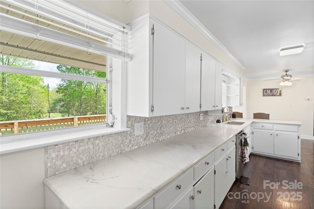kitchen featuring dark wood-style floors, white cabinetry, and tasteful backsplash