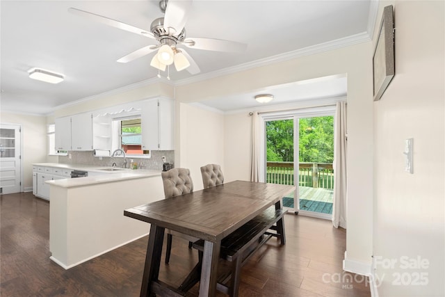 dining area with a ceiling fan, dark wood-style flooring, crown molding, and baseboards
