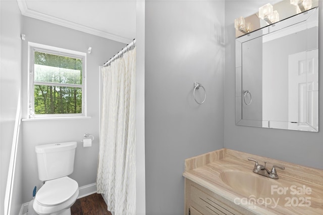 full bathroom featuring crown molding, wood finished floors, vanity, baseboards, and toilet