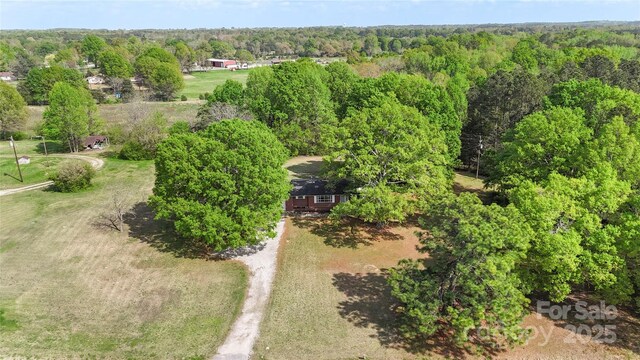 bird's eye view featuring a view of trees