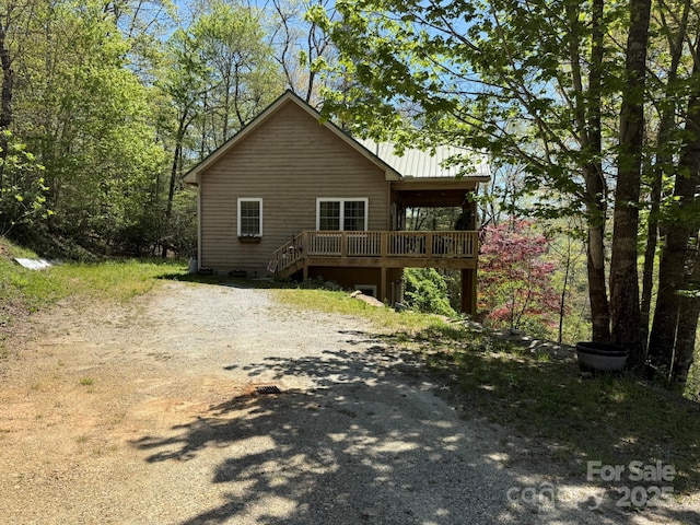 50 Honey Mountain Ln, Lake Toxaway, NC 28747 - back of house with a wooden deck and dirt driveway