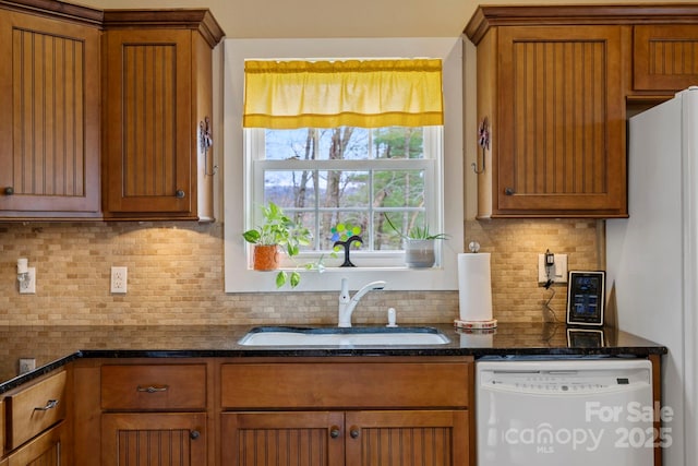 50 Honey Mountain Ln, Lake Toxaway, NC 28747 - kitchen with white appliances, brown cabinetry, backsplash, and dark stone counters