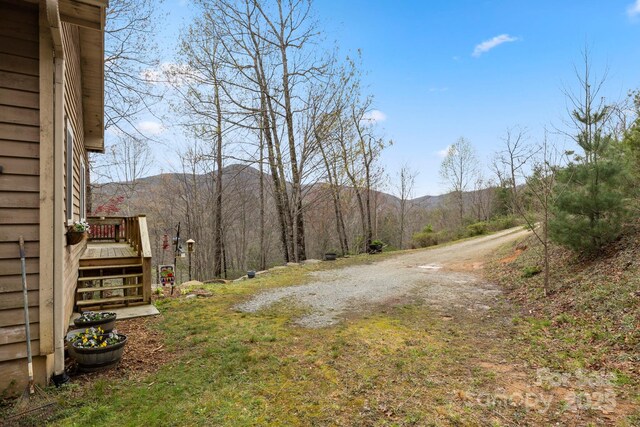 50 Honey Mountain Ln, Lake Toxaway, NC 28747 - view of yard with a deck with mountain view