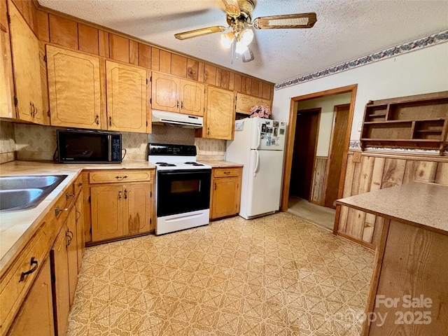 138 Friendship Dr, Ellenboro, NC 28040 - kitchen with range with electric cooktop, freestanding refrigerator, a textured ceiling, under cabinet range hood, and light floors
