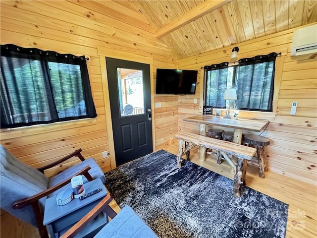 interior space featuring wooden walls, wooden ceiling, a wall mounted air conditioner, and wood finished floors