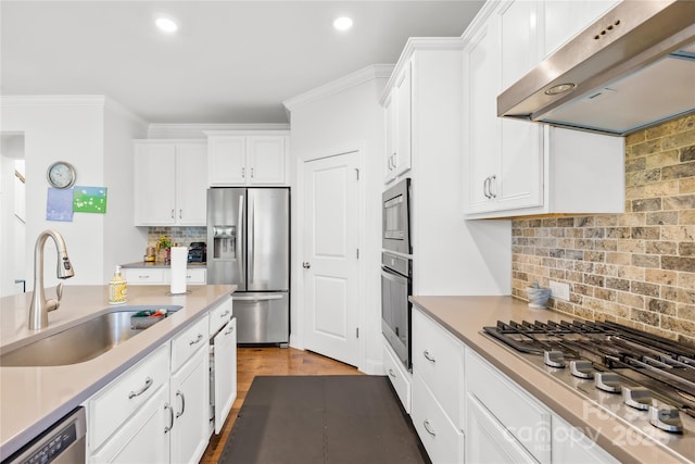 12305 Stinson Ct, Charlotte, NC 28277 - kitchen featuring backsplash, white cabinets, under cabinet range hood, stainless steel appliances, and a sink