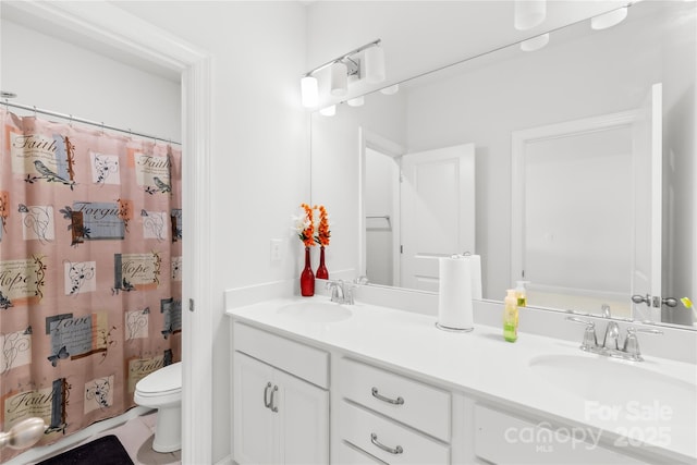 12305 Stinson Ct, Charlotte, NC 28277 - bathroom with double vanity, curtained shower, a sink, and toilet