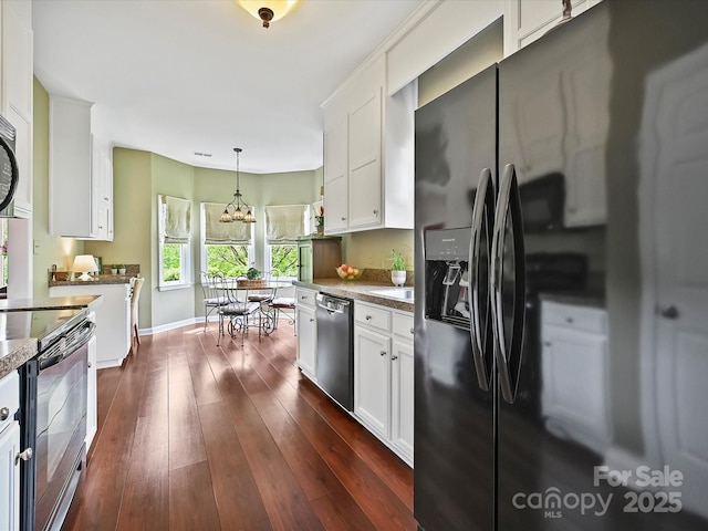 2516 Middlebridge Ln, Charlotte, NC 28270 - kitchen featuring white cabinets, dishwashing machine, electric stove, dark wood finished floors, and black fridge