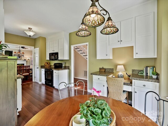 2516 Middlebridge Ln, Charlotte, NC 28270 - dining space with visible vents, stairway, and dark wood-style flooring