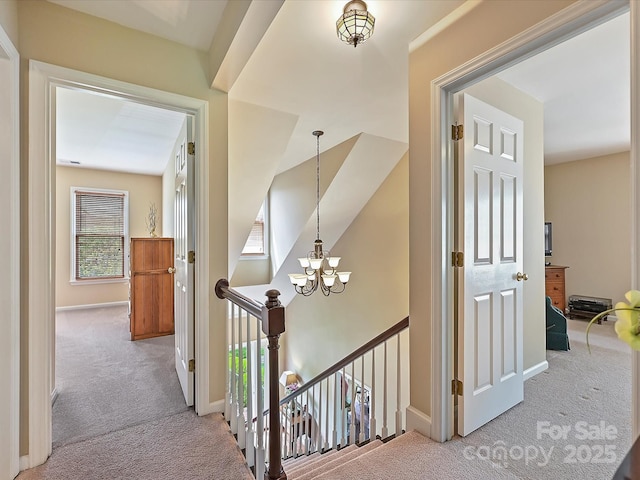 2516 Middlebridge Ln, Charlotte, NC 28270 - hall featuring an upstairs landing, an inviting chandelier, baseboards, and carpet floors