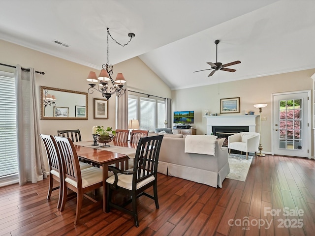 2516 Middlebridge Ln, Charlotte, NC 28270 - dining room featuring dark wood-style floors, visible vents, vaulted ceiling, and ceiling fan with notable chandelier