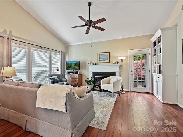2516 Middlebridge Ln, Charlotte, NC 28270 - living area with lofted ceiling, baseboards, a glass covered fireplace, wood finished floors, and a ceiling fan