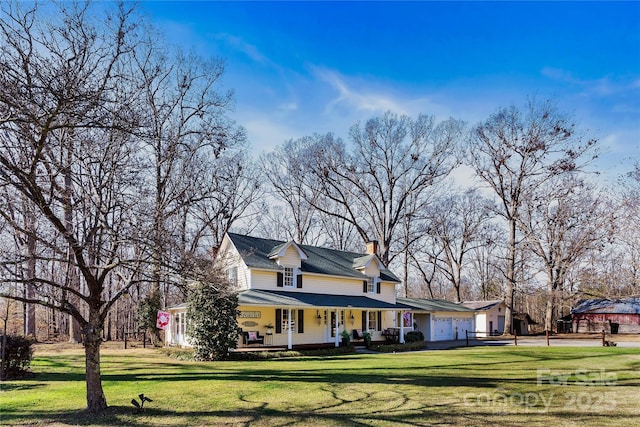 447 Henderson Rd, Chesnee, SC 29323 - country-style home featuring a porch, a chimney, and a front yard