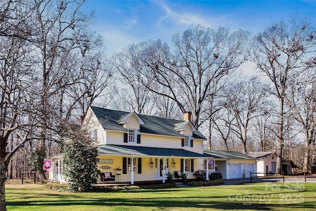 447 Henderson Rd, Chesnee, SC 29323 - farmhouse-style home featuring a front lawn, a chimney, an attached garage, and covered porch