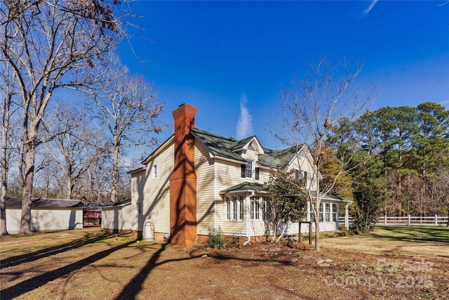 447 Henderson Rd, Chesnee, SC 29323 - view of side of property featuring a chimney and fence