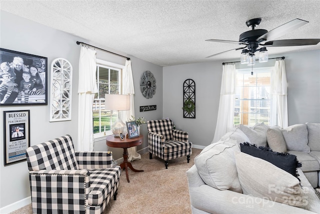 447 Henderson Rd, Chesnee, SC 29323 - living room with carpet floors, baseboards, a ceiling fan, and a textured ceiling