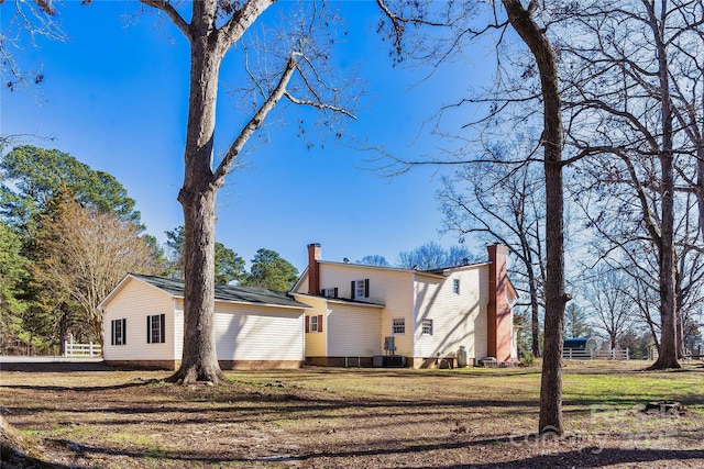 447 Henderson Rd, Chesnee, SC 29323 - rear view of property with a chimney and a lawn