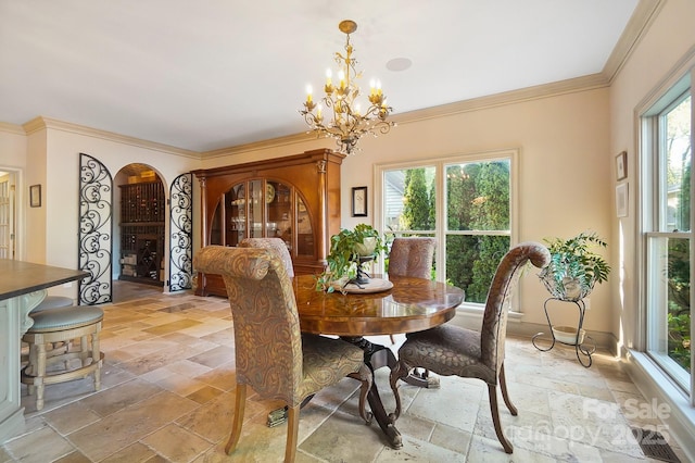 dining space featuring crown molding, visible vents, a notable chandelier, and stone tile floors