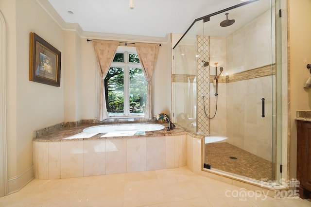 full bathroom featuring tile patterned floors, a bath, and a stall shower