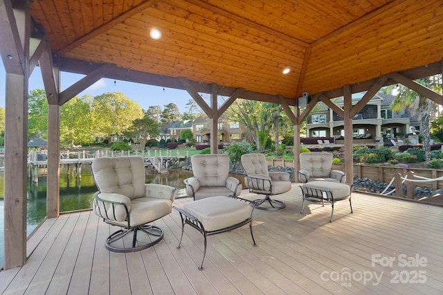 deck with a water view and a gazebo