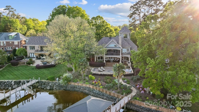 20428 Island Forest Dr, Cornelius, NC 28031 - back of house with a balcony, a patio, a water view, and a lawn