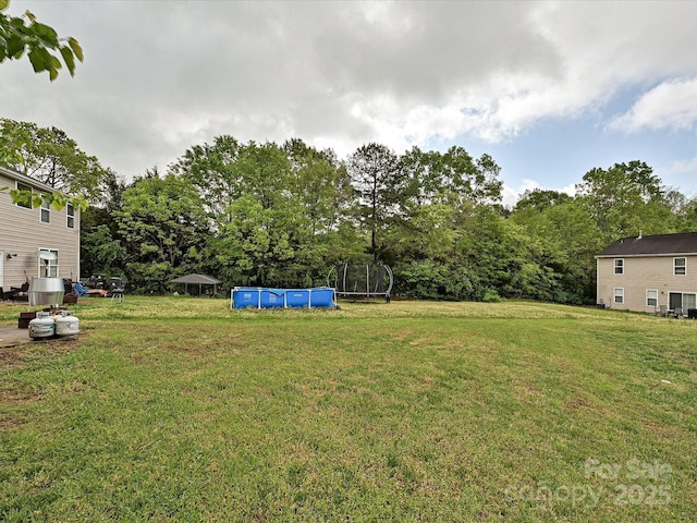 view of yard with an outdoor pool