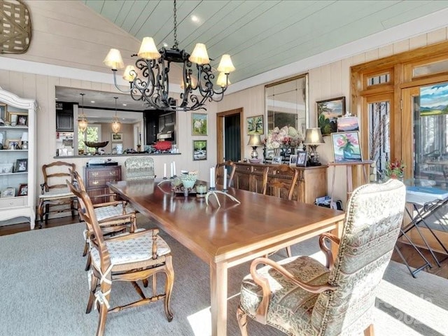 116 Dana Rd, Waynesville, NC 28786 - dining space with wood ceiling, wood finished floors, wooden walls, and a notable chandelier
