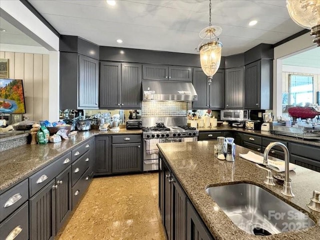 116 Dana Rd, Waynesville, NC 28786 - kitchen featuring under cabinet range hood, hanging light fixtures, a sink, and dark stone countertops