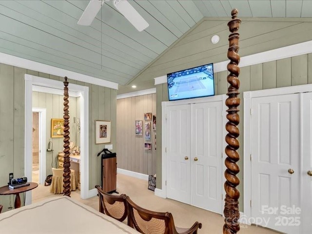 116 Dana Rd, Waynesville, NC 28786 - bedroom featuring light carpet, ensuite bath, wooden walls, a ceiling fan, and lofted ceiling