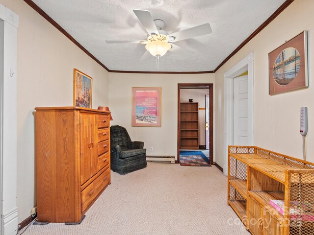living area featuring a textured ceiling, light colored carpet, ornamental molding, a ceiling fan, and a baseboard radiator