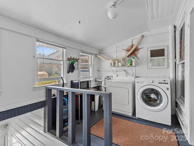 laundry room with washer and clothes dryer, laundry area, and baseboard heating
